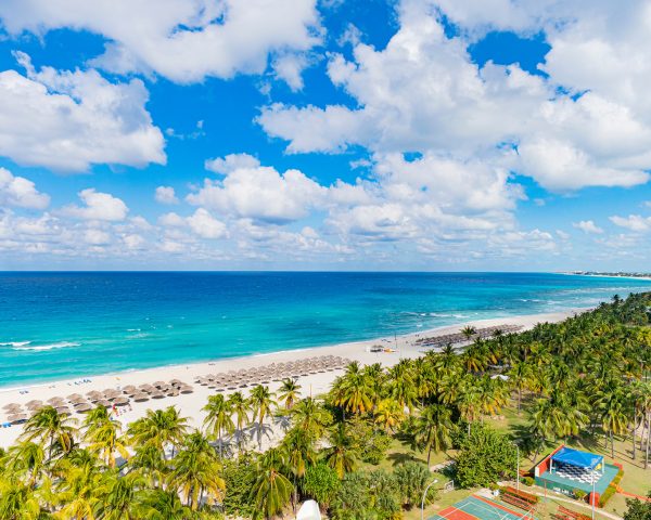 Top view of the resort town of Varadero. Cuba. Long beach is 20 km away with sun loungers and thatched umbrellas and lots of palm trees.